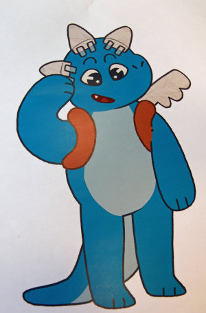 Maskottchen Pino wirbt im Oberbergischen Kreis für das (Vor-)Lesen. (Grafik: Colin Biltgen/ Foto: OBK) Maskottchen Pino wirbt im Oberbergischen Kreis für das (Vor-)Lesen. (Grafik: Colin Biltgen/ Foto: OBK)