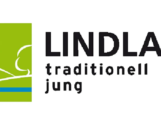 Logo mit stilisiertem roten Kirchturm auf grünem Hintergrund, daneben der Schriftzug 'LINDLAR traditionell jung' in Schwarz.