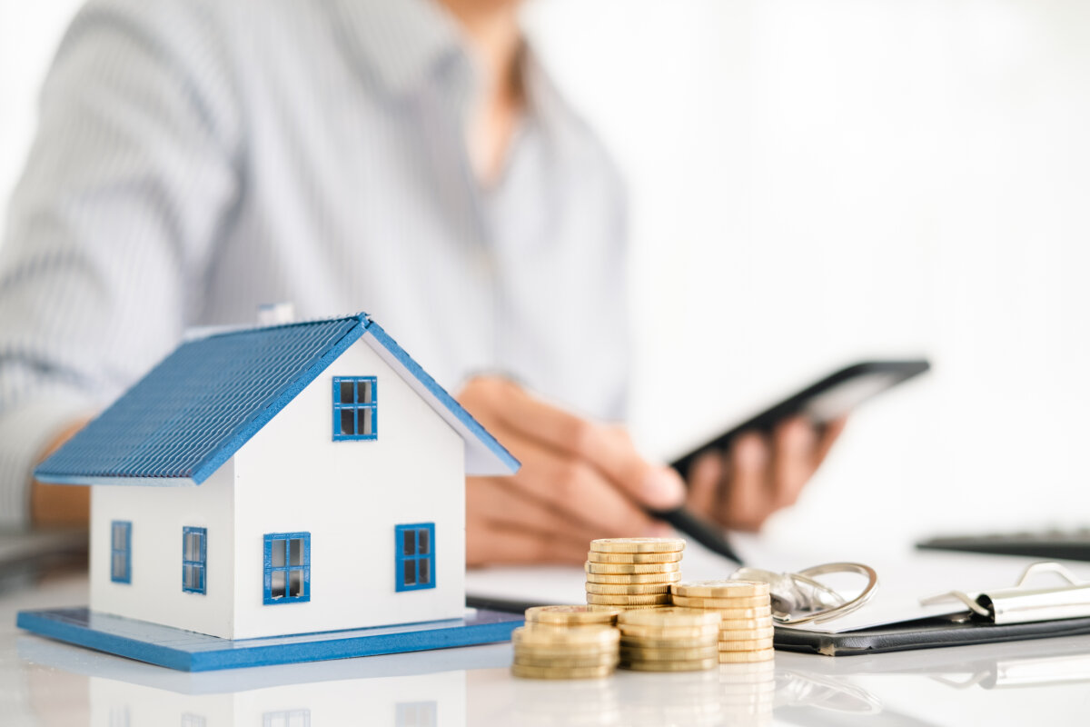 House model with real estate agent and customer discussing for contract to buy house, insurance or loan real estate background.