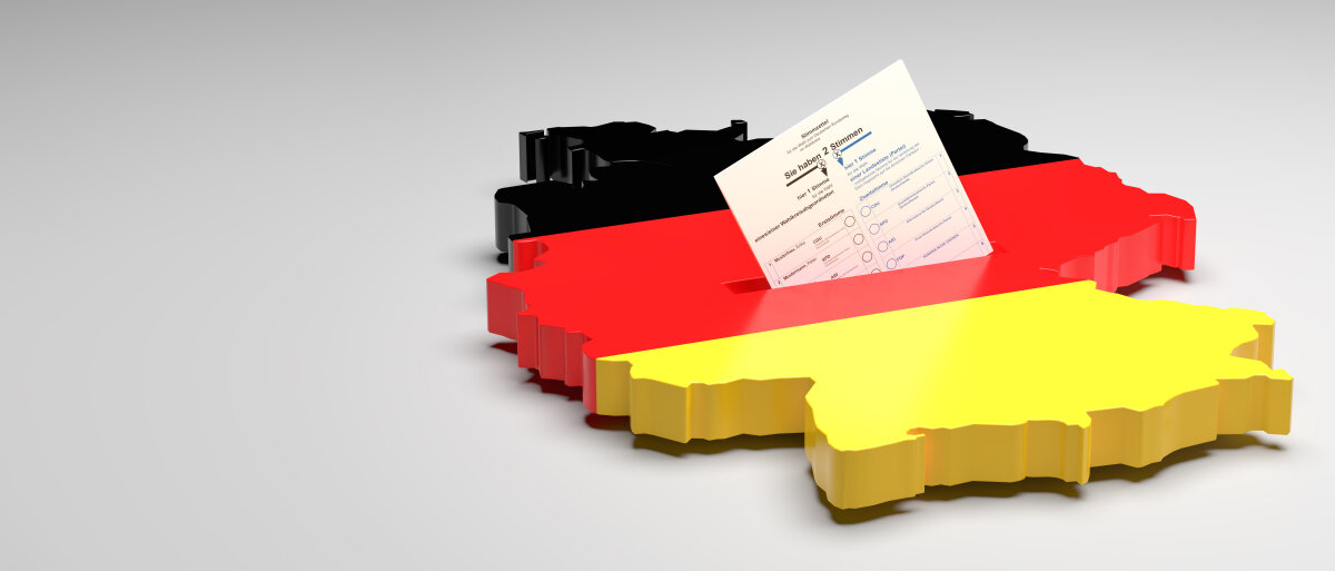 Elections in Germany. A sample ballot paper for the election to the Bundestag in the slit of a ballot box in the form of the German map with the German flag. 3d render, gray background, copy space