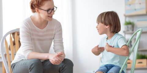Boy talking with child psychotherapist