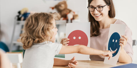 Emotion emoticons used by a psychologist during a therapy session with a child with an autism spectrum disorder.