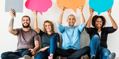 People carrying speech bubble icons