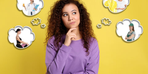 Thoughtful African American woman choosing probable profession on yellow background