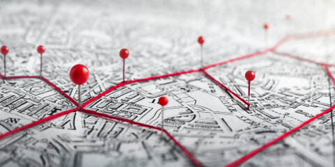 Routes with red pins on a city map. Concept on the  adventure, discovery, navigation, communication, logistics, geography, transport and travel topics.