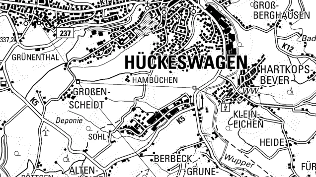 Ausschnitt einer schwarz-weißen topografischen Karte der Region Hückeswagen. Beschriftungen zeigen Ortsnamen wie Großen-Scheidt, Klein-Eichen und Hartkopsbever sowie Straßen und geografische Merkmale.